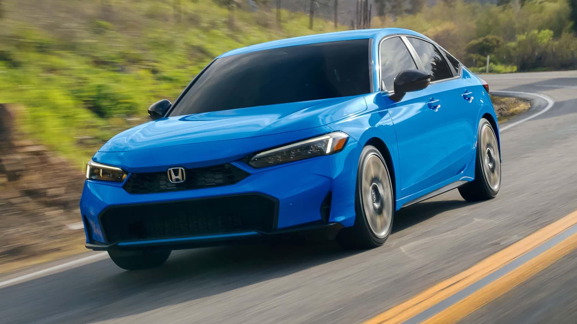 Image: Front grille close-up
Alt Text: Updated 2025 Honda Civic grille and LED headlights